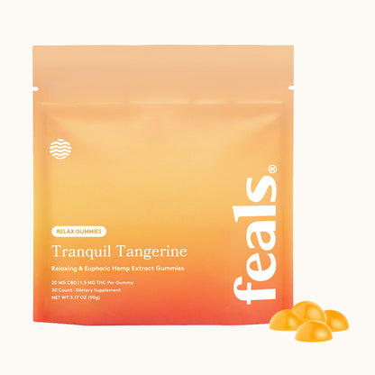 A stand-up pouch of Feals Tranquil Tangerine Relax Gummies, featuring a warm orange-to-yellow gradient packaging with white text, shown on a clean white background with several gummies displayed at the bottom right.